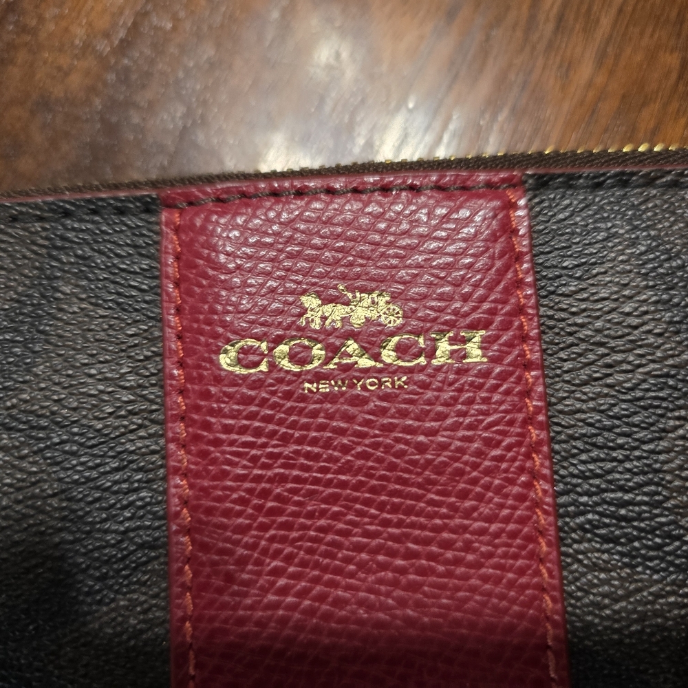 Coach Pebbled Leather Wristlet in Black and Burgundy with Gold Logo